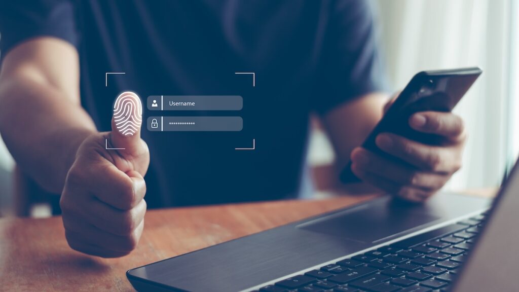 A man proves his identity through biometric identification. Biometric ID is one way you can reach the Safe Harbour standard.