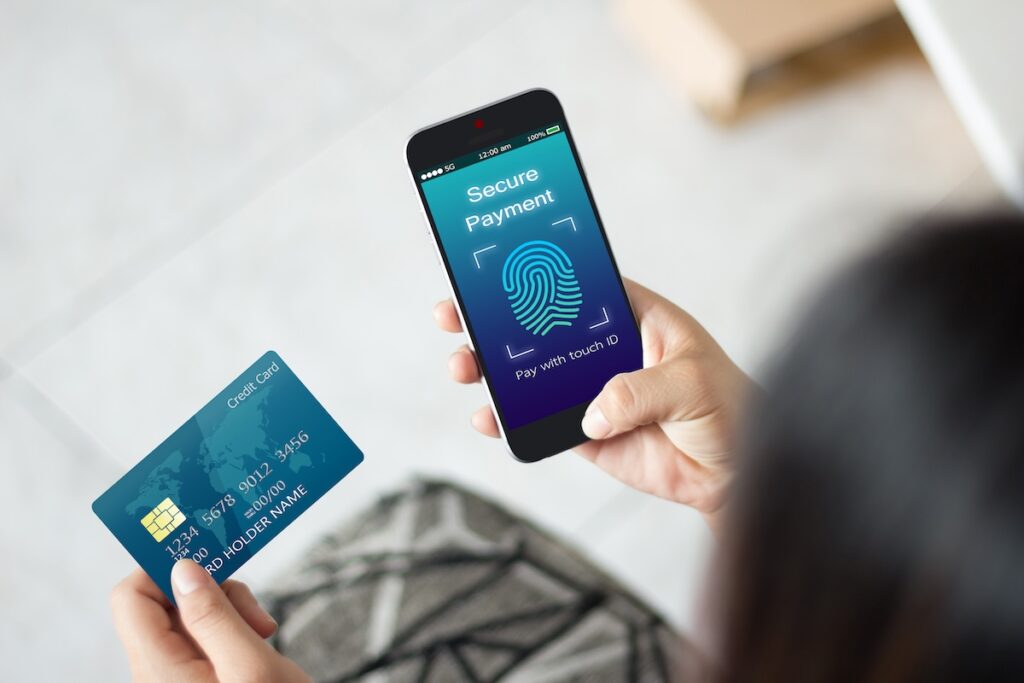 A woman makes a secure payment. Checkboard helps customers transfer money safely and securely.