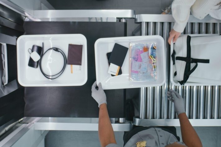 Baggage being passed through security checks.
