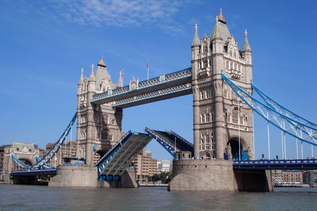 Tower Bridge in London, raising its bridge section to let a boat pass.